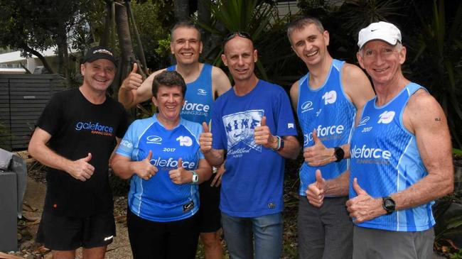 GET SET: Steve Moneghetti (centre) with Chris Gale (left) and the Galeforce runners in Sunshine Beach. Picture: Peter Gardiner