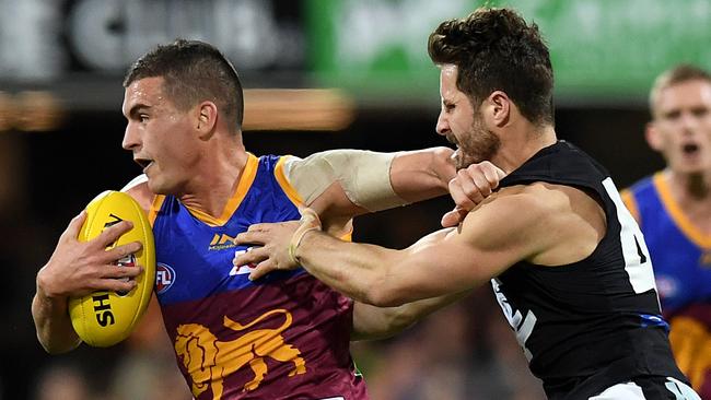 Brisbane free-agent midfielder Tom Rockliff, left, pushed aside a “come-home” offer from Carlton to take up a four-year contract with Port Adelaide considering Adelaide as the best place for his family life after becoming a father in September. Picture: Dan Peled