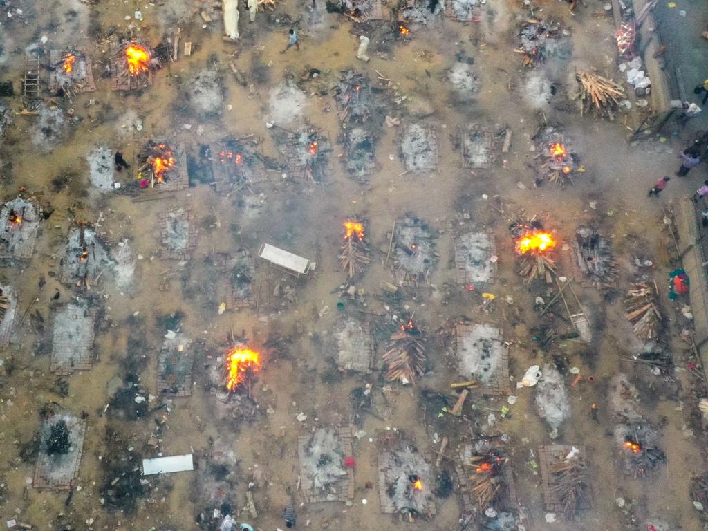 Burning pyres of victims who lost their lives due to the COVID-19 coronavirus are seen at a cremation ground in New Delhi. Picture: Jewel Samad/AFP