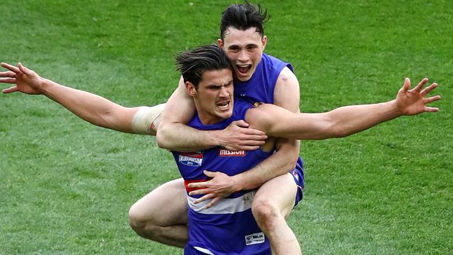 Toby McLean jumps on Tom Boyd after his last-quarter goal. Picture: George Salpigtidis