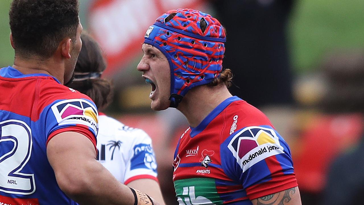 Newcastle's Kalyn Ponga celebrates after scoring a try.