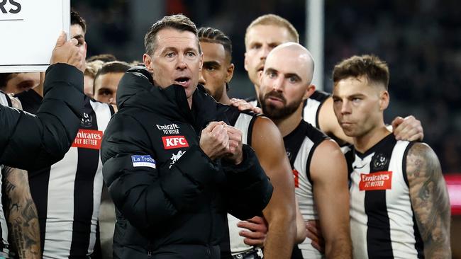 MELBOURNE, AUSTRALIA - JULY 12: Craig McRae, Senior Coach of the Magpies addresses his players during the 2024 AFL Round 18 match between the Collingwood Magpies and the Geelong Cats at Melbourne Cricket Ground on July 12, 2024 in Melbourne, Australia. (Photo by Michael Willson/AFL Photos via Getty Images)