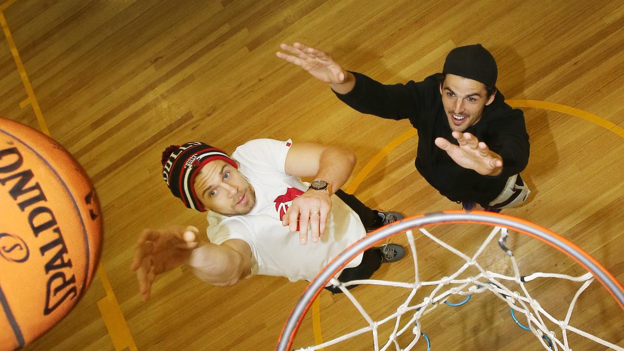 Scott Pendlebury and Brett Deledio playing one-on-one basketball. Picture: Yuri Kouzmin