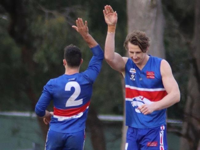 Tom Merlino and Daniel Gorringe celebrate a goal for Wandin. Picture: BH Photography (Bethany Hutchison)