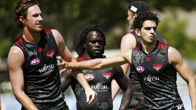 Essendon cheapies Mitch Brown (left) and Anthony McDonald-Tipungwuti (centre) are running out of steam. Picture: Colleen Petch.