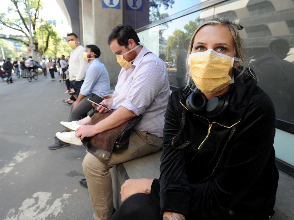 At the time of this picture, Izzy from West Footscray had queued for over two hours outside the Royal Melbourne Hospital waiting to be tested for coronavirus. Picture: Andrew Henshaw