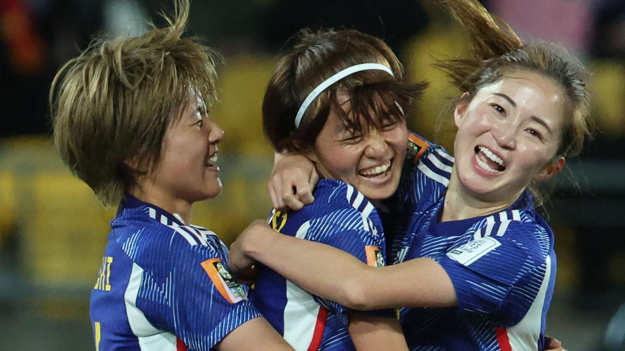 Japan's midfielder #07 Hinata Miyazawa (C) celebrates with her teammates after scoring her team's third goal during the Australia and New Zealand 2023 Women's World Cup Group C football match between Japan and Spain at Wellington Stadium, also known as Sky Stadium, in Wellington on July 31, 2023. (Photo by Marty MELVILLE / AFP)