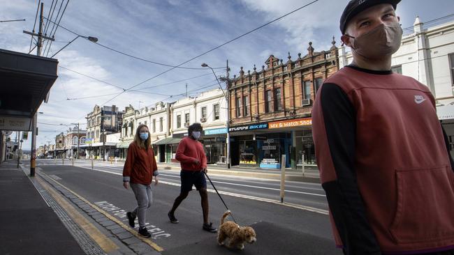 People walk on a deserted Bridge Rd Richmond on Sunday morning. Picture: NCA NewsWire/David Geraghty