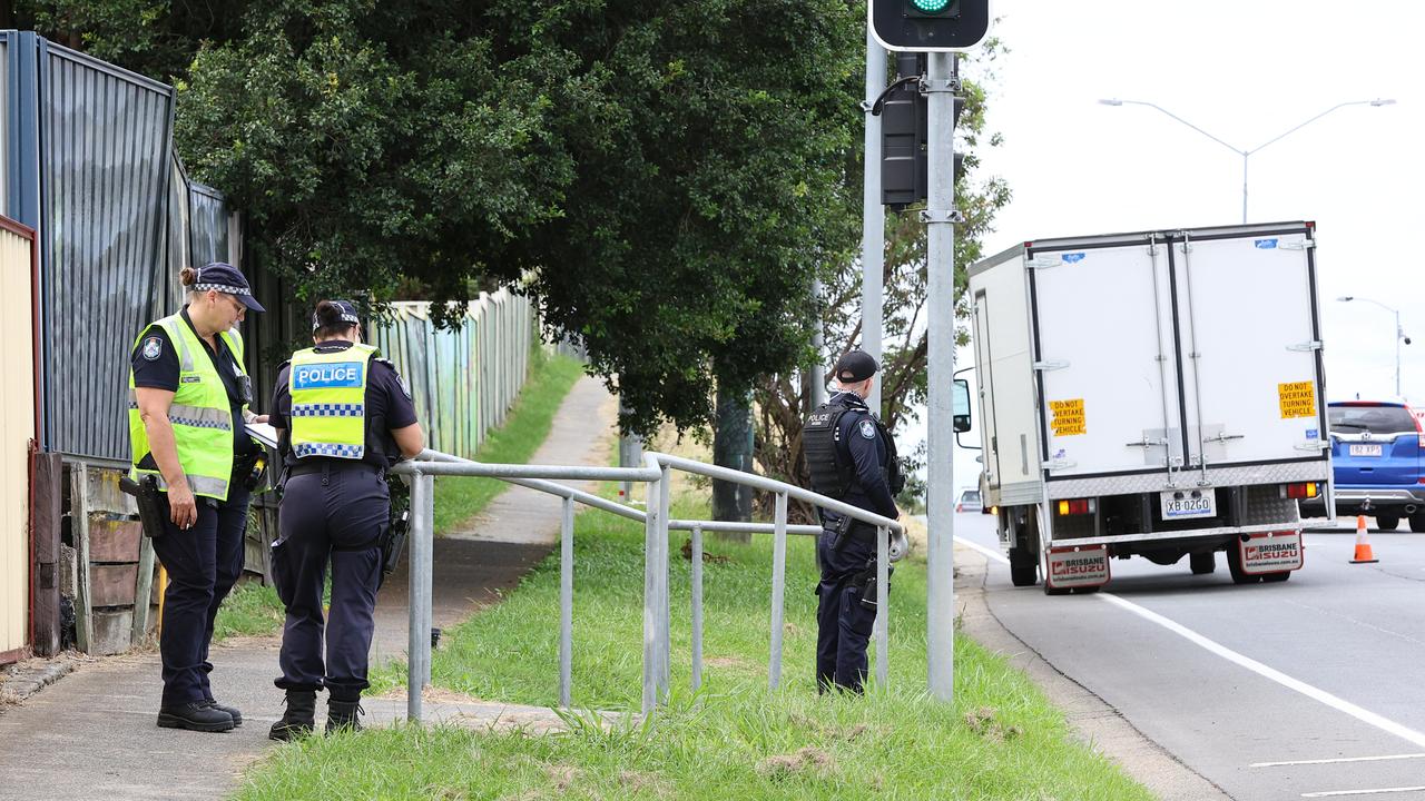 Police at the scene of the incident on Browns Plains Road. Picture: David Clark