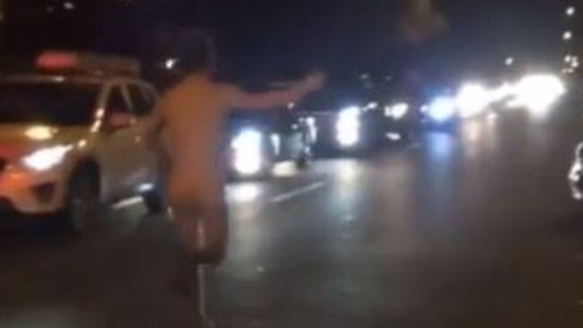 Naked joy...A streaker runs through Cronulla traffic in celebratuion last night.