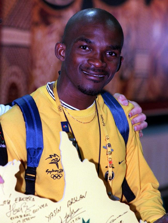 Equitorial Guinea swimmer Eric "the eel" Moussambani leaves Sydney International Airport at Mascot, after completion of Olympic Games. (Picture: Supplied)