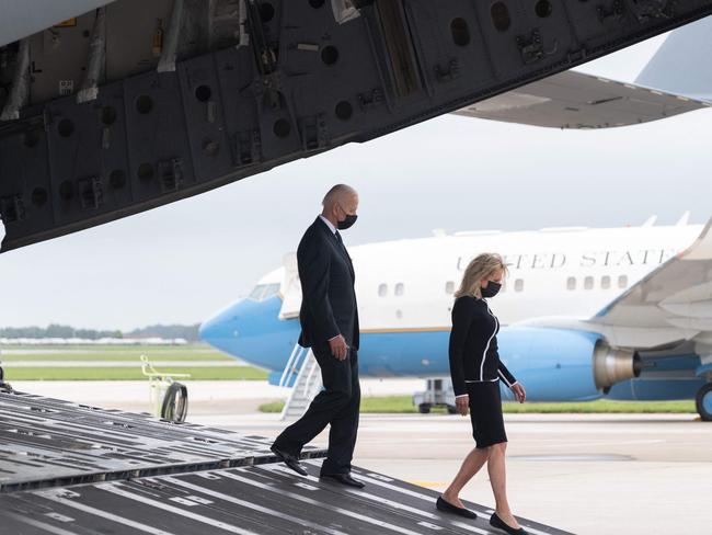 US President Joe Biden and First Lady Jill Biden walk off a military aircraft following a prayer as he attends the dignified transfer of the remains of the 13 fallen service members killed in Afghanistan last week, at Dover Air Force Base in Dover, Delaware. Picture: AFP