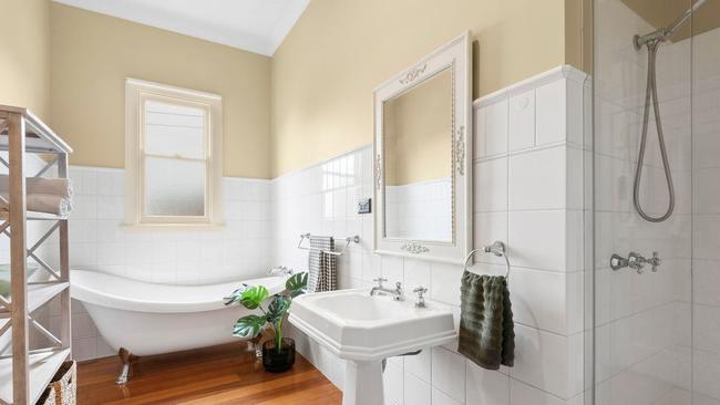 The main bathroom features a deep clawfoot bath.