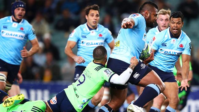 Waratahs winger Taqele Naiyaravoro tries to steamroller through the Highlanders defence on Saturday night.