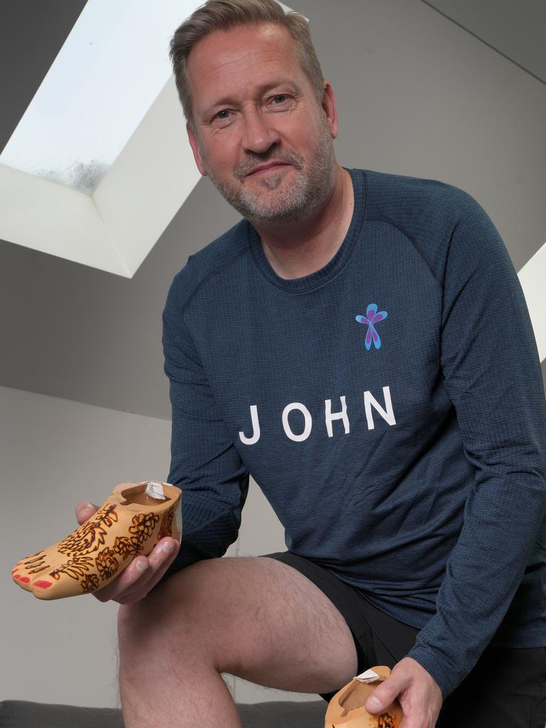 John Mannion holding the first prosthetic feet made for Adelaide's Gill Hicks, who was in the London bombing almost 20 years ago. Picture: Dean Martin