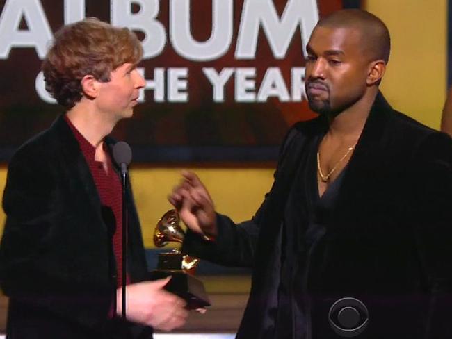 Angry man ... Kanye West storms the stage as Beck beats Beyonce to win Album of the Year at the Grammy Awards.