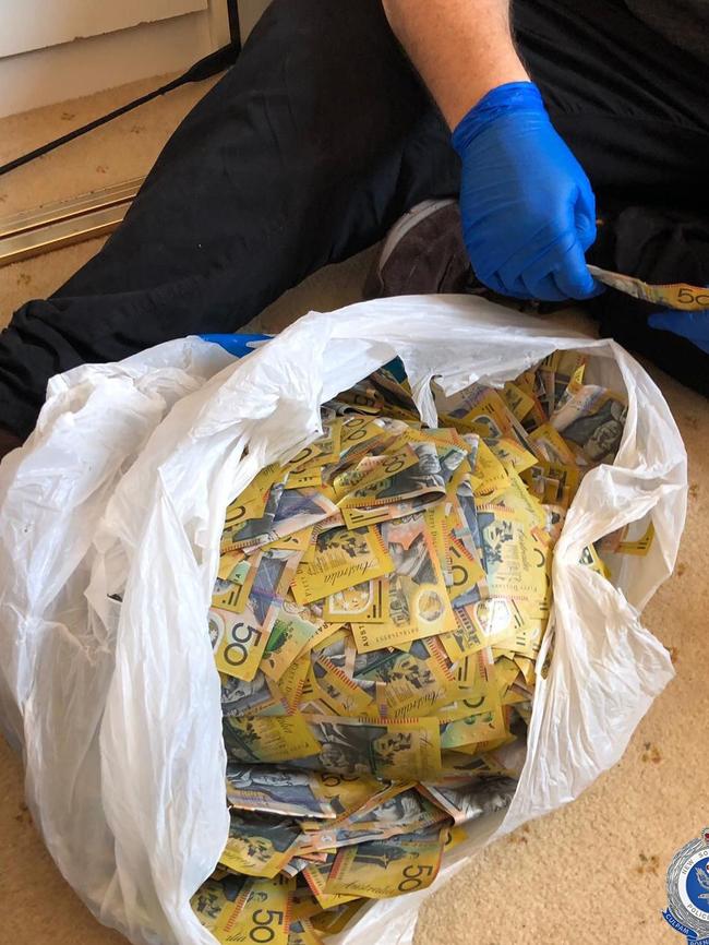 Police seize the cash. Picture: NSW Police