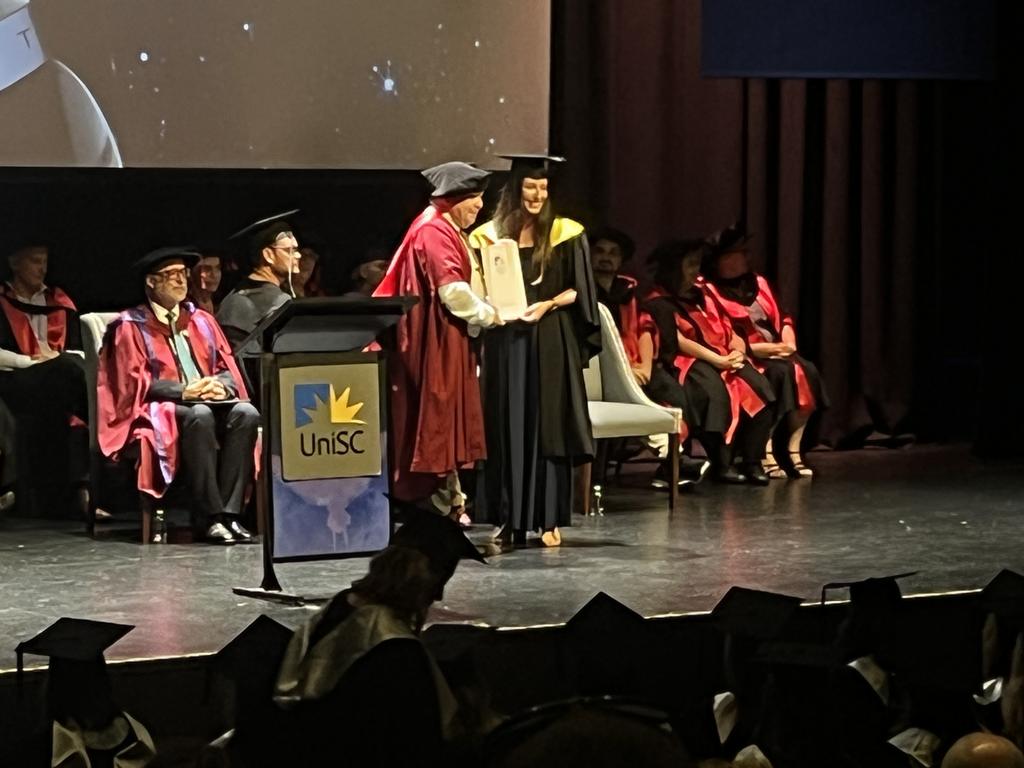 Graduates from the University of the Sunshine Coast's Fraser Coast campus celebrating at the Brolga Theatre.