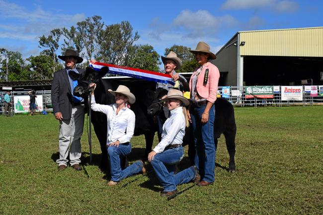 BEST OF THE BEST: Stud cattle judges Ben Adams (left) and Cherie Gooding (right) flank Chloe Gould, Bowenfels owner Glen Perrett and Nateesha Taylor with Champion of Champions Bowenfels Jedda and calf at foot, Bowenfels Man of War. Picture: Arthur Gorrie