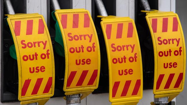 Out of service signs on fuel pumps at a Shell garage which is out of all fuel. Photo: by Chris J Ratcliffe/Getty Images