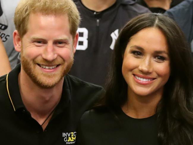 LONDON, ENGLAND - JUNE 29: In this handout image provided by The Invictus Games Foundation, Prince Harry, Duke of Sussex and Meghan, Duchess of Sussex join the New York Yankees in their Clubhouse and receive gifts for Archie ahead of their match against the Boston Red Sox at the London Stadium on June 29, 2019 in London, England. The historic two-game "You Just Cant Beat The Person Who Never Gives Up" series marks the sports first games ever played in Europe and The Invictus Games Foundation has been selected as the official charity of Mitel and MLB London Series 2019. (Photo by Handout/Chris Jackson/Invictus Games Foundation via Getty Images)