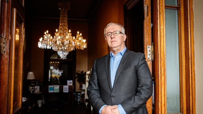 Dr. Darren Peacock, CEO National Trust SA at Ayers House with an original chandelier purchased by Sir Henry Ayers, which will not remain if the government evicts the Trust. Picture Matt Turner.