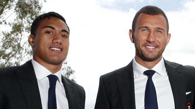 Jamie-Jerry Taulagi (left) with Reds teammate Quade Cooper. Picture: Darren England.