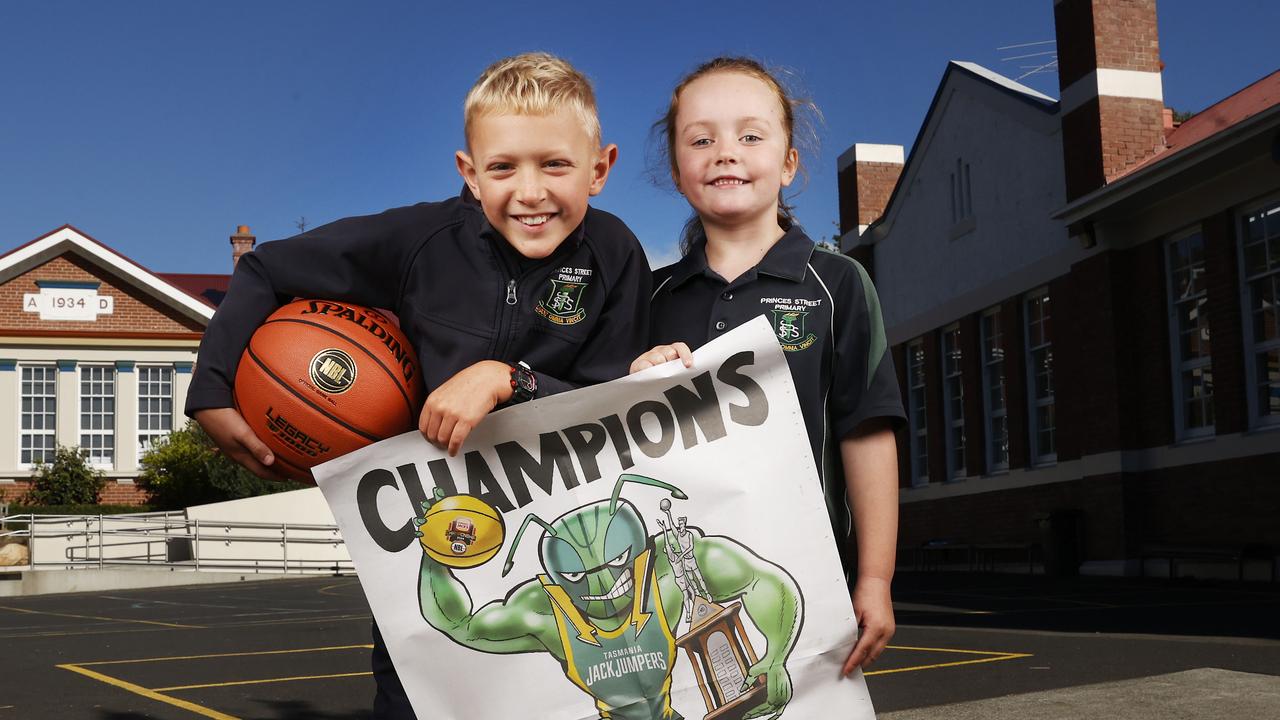 Princes Street Primary School students Jude Canvin and Grace Pennicott show off the poster by Mark Knight. Picture: Nikki Davis-Jones