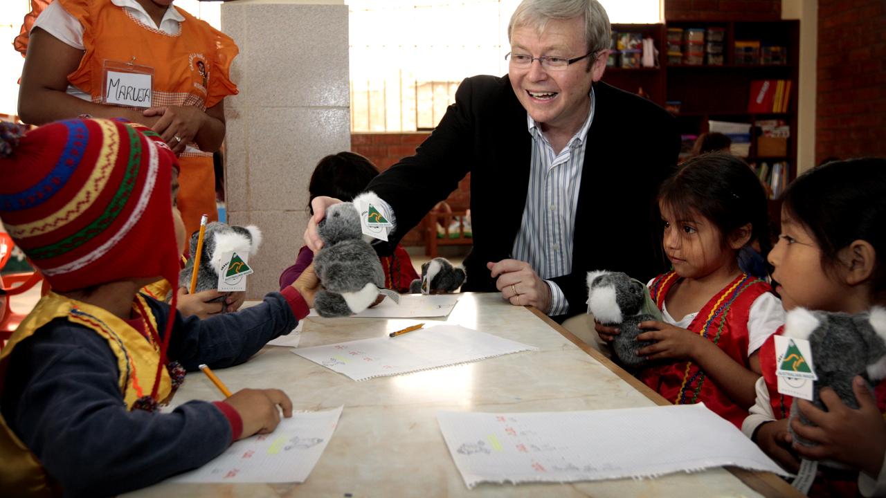 Prime Minister Kevin Rudd giving out toy koala's to children at the daycare centre while visiting the Sisters of Mercy Family Health Service in Huandoy, Lima, Peru while attending the 2008 APEC Summit.