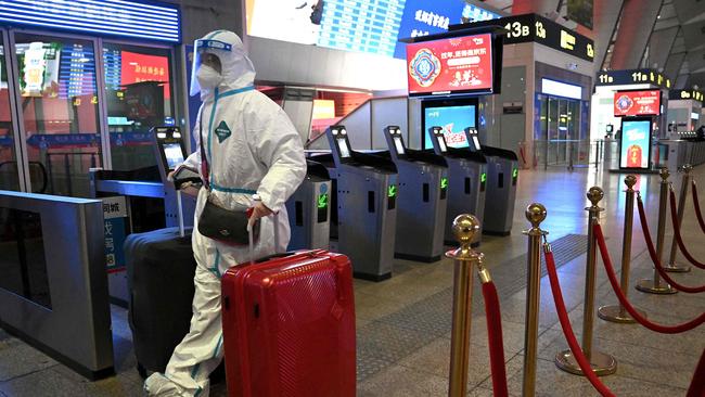 A passenger arrives at a train station in Beijing this week. Picture: AFP