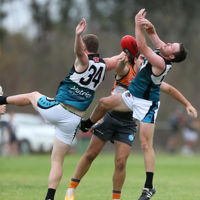 CDHBU duo Deaken Clancy and Thomas Moloney compete with RWW Giants player Hayden Wardius. Picture: Yuri Kouzmin