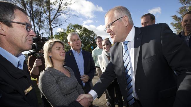 Prime Minister Scott Morrison pressing the flesh at Parramatta Creek in Tasmania’s Braddon electorate. PICTURE CHRIS KIDD