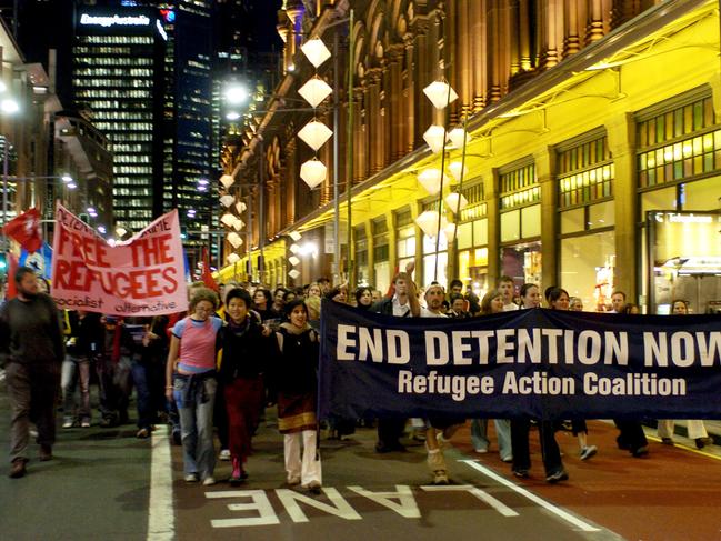 Sydney, August 26, 2005. Refugee supporters march along Sydney's George street to commemorate 'Tampa Day'. Tampa Day is a protest by the refugee support movement about an incident four years ago when the Howard government requested the crew of the vessel MV Tampa to assist asylum seekers whose boat was in danger of sinking off the West Australian coast only to be then refused permission to enter Australian waters. (AAP Image/Dean Lewins) NO ARCHIVING