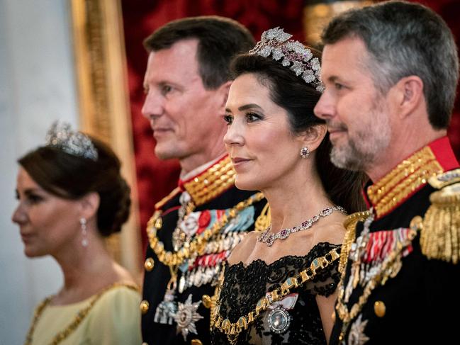 Crown Princess Mary attends a gala banquet at Christiansborg Palace with her husband and brother-in-law. Picture: AFP