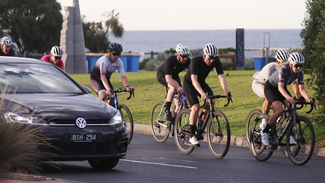 Riders brave Beach Rd the day after a motorist ran down two cyclists. Picture: David Crosling