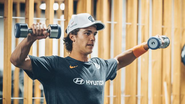 Ben Silvagni works out in the weights room at Carlton.