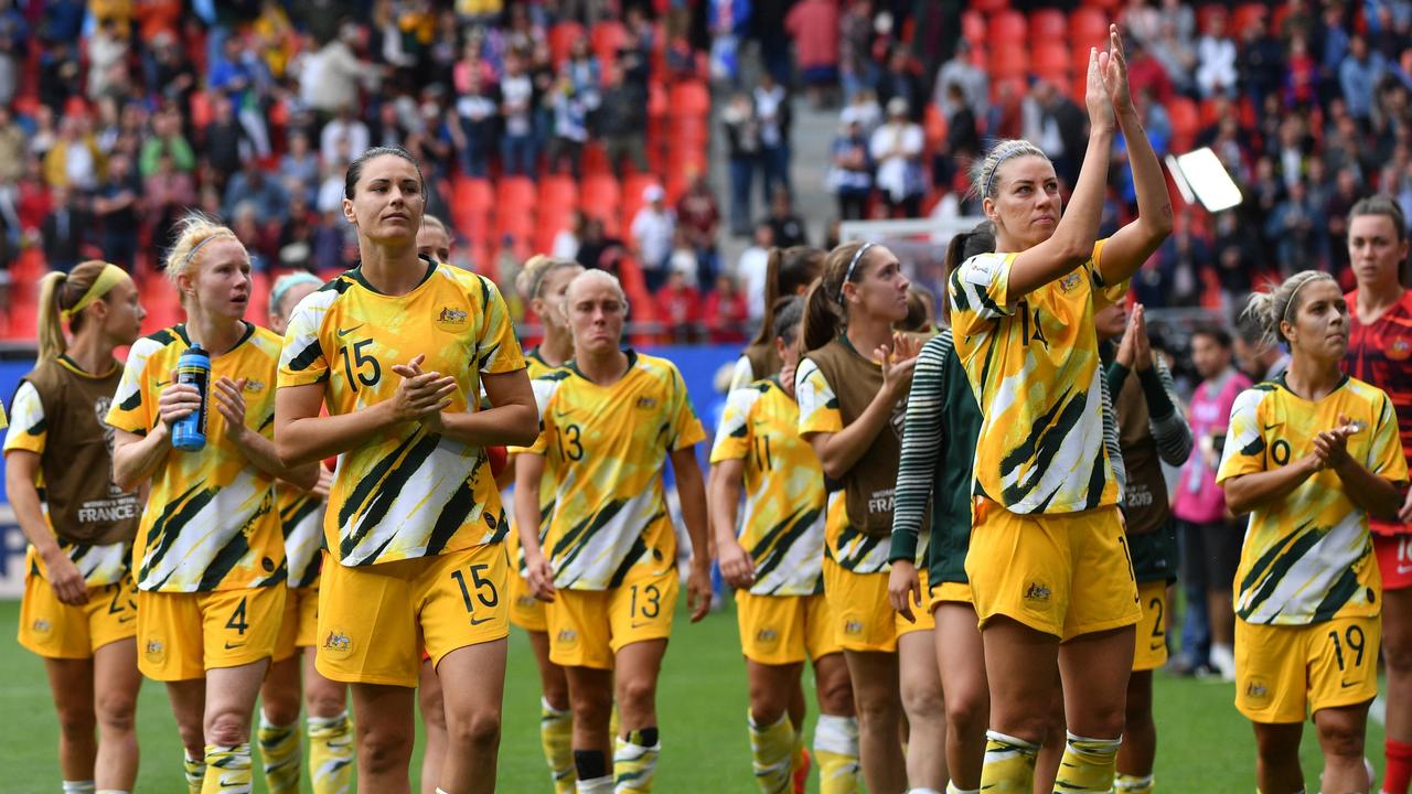Australian players react at the end of the France 2019 Women's World Cup Group C football match between Australia and Italy, on June 9, 2019, at the Hainaut Stadium in Valenciennes, northern France. (Photo by Philippe HUGUEN / AFP)