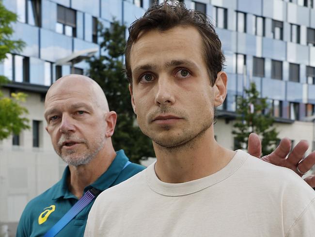 Tom Craig, right, walks free from a Paris police station after being let off with a warning. Picture: Michael Klein