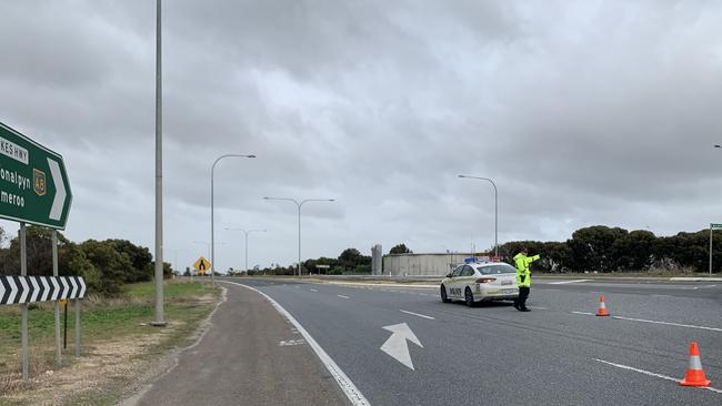 Police divert traffic after a serious crash occurred between a Motorcyclist and a truck near Tailem Bend. Picture: Emma Brasier