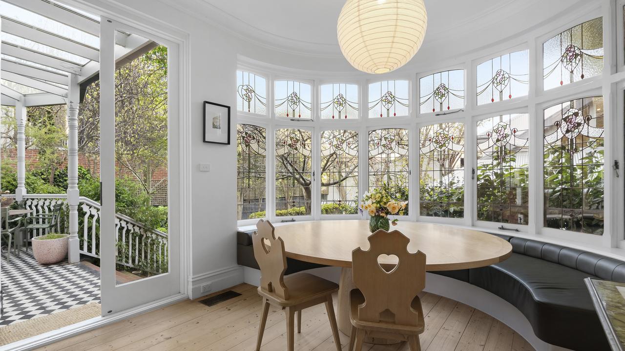 Leadlight windows provide a sunny spot for dining.