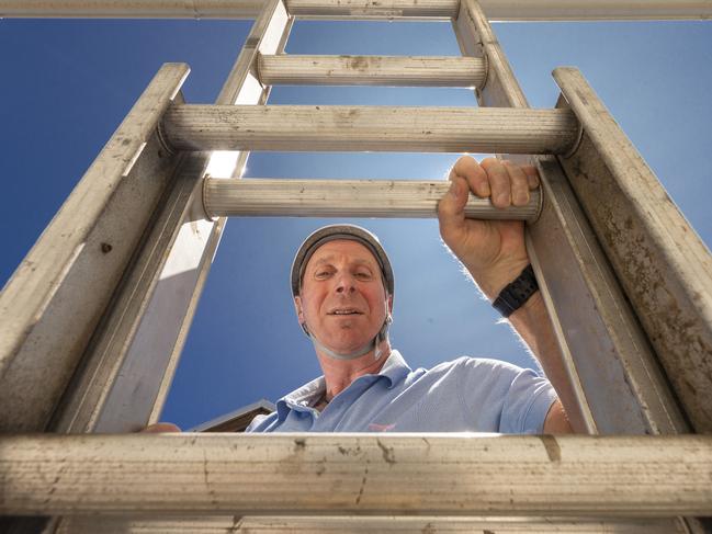 Gary Mann always wears a helmet to climb ladders after a 6m fall left him with serious injuries. Picture: Valeriu Campan