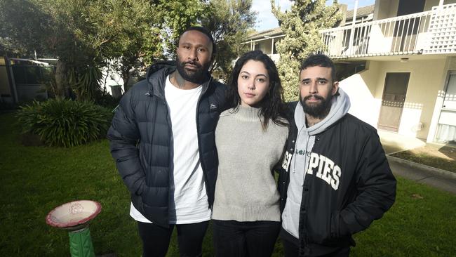 Rasta, Jeorja and Damien Gasio at the apartment block at Mordialloc where their father Saumotu was murdered in 2022. Picture: Andrew Henshaw