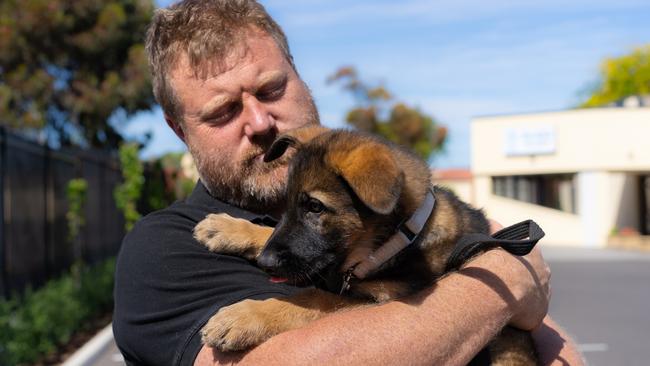 OZCORPK9 training manager Ryan King pictured with his new puppy, Beowulf. Picture: Supplied.