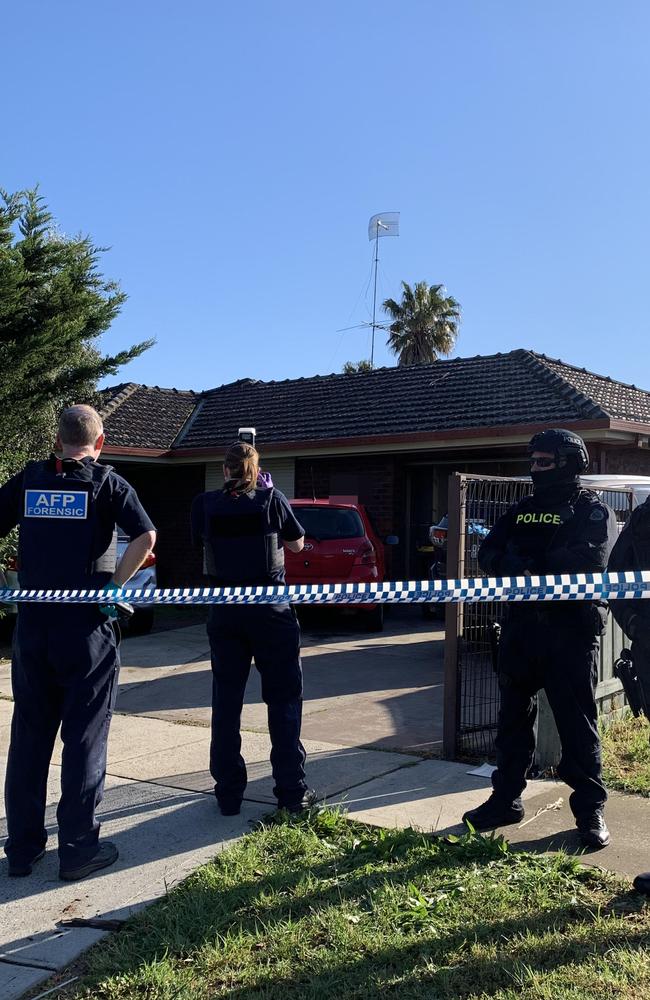 Specialist police have swarmed on a house linked to the man behind Friday's horror Bourke St attack.