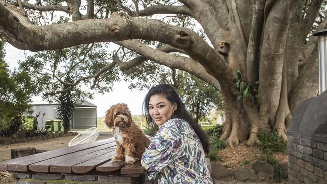 Ruchi Shrestha and Miss Noodle the cavoodle relax at the luxury Bunya Bunya Estate Airbnb. Picture: Nev Madsen