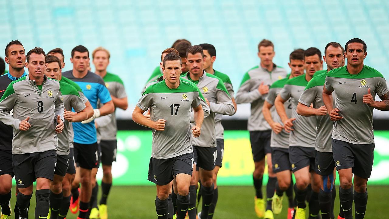 SYDNEY, AUSTRALIA - MAY 25: Australian players warm up during an Australian Socceroos training session at ANZ Stadium on May 25, 2014 in Sydney, Australia. (Photo by Brendon Thorne/Getty Images)