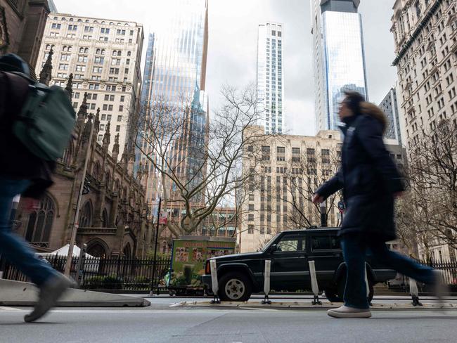 People walk through lower Manhattan moments after New York City and parts of New Jersey experienced a 4.8 magnitude earthquake. Picture: Getty Images via AFP