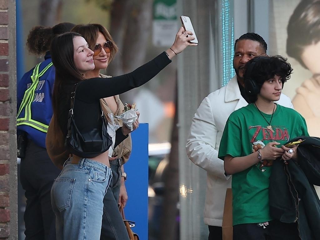 In what must be Emme’s everyday life, a fan stops J-Lo for a quick selfie as they leave the restaurant. Picture: Backgrid