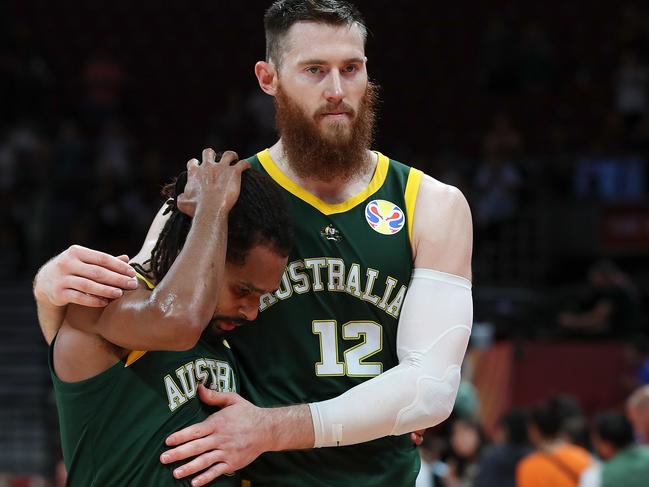 BEIJING, CHINA - SEPTEMBER 13:  Aron Baynes with Patty Mills of Australia reacts after lose the game against Spain during the semi-finals of 2019 FIBA World Cup match between Spain and Australia at Beijing Wukesong Sport Arena on September 13, 2019 in Beijing, China.  (Photo by Lintao Zhang/Getty Images)