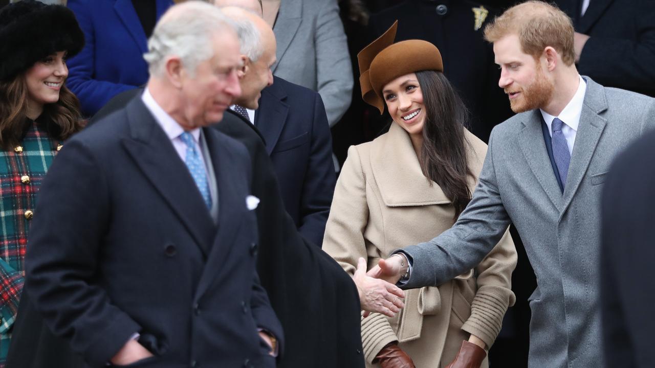 Charles, Meghan and Harry in happier times. Picture: Getty Images